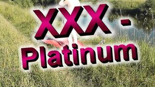 Wild beach. Sexy MILF Platinum naked sunbathing on river bank, random fisherman guy watches. Naked in public. Nude beach