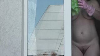 Neighbor taxi driver from window car again looks at neighbor MILF who washes window of apartment naked. Nude in public - 14 image