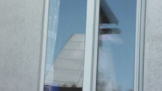 Neighbor taxi driver from window car again looks at neighbor MILF who washes window of apartment naked. Nude in public - 3 image