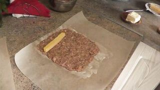 In stockings in high heels no panties and bra sexy mommy MILF Frina continues her nude cooking. Hot and cold minced meat roll on the menu today