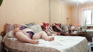 Mother-in-law masturbates her meaty pussy in the evenings and rubs her big tits - 1 image