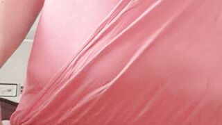 in the kitchen half-dressed