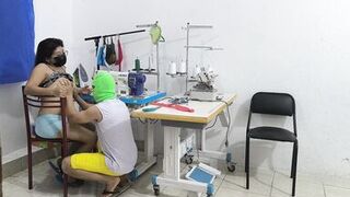 A horny and slutty seamstress seduces her coworker. She invites him over for sex, and her partner sucks her vagina like a whore.